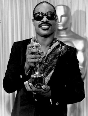 Stevie Wonder receiving Oscar